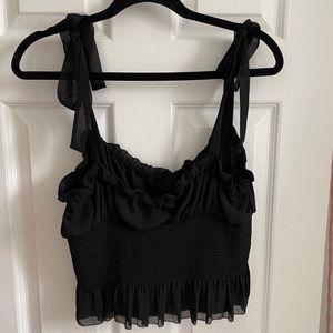 Aritzia women’s black sleeveless blouse. Size large. Like new, never worn